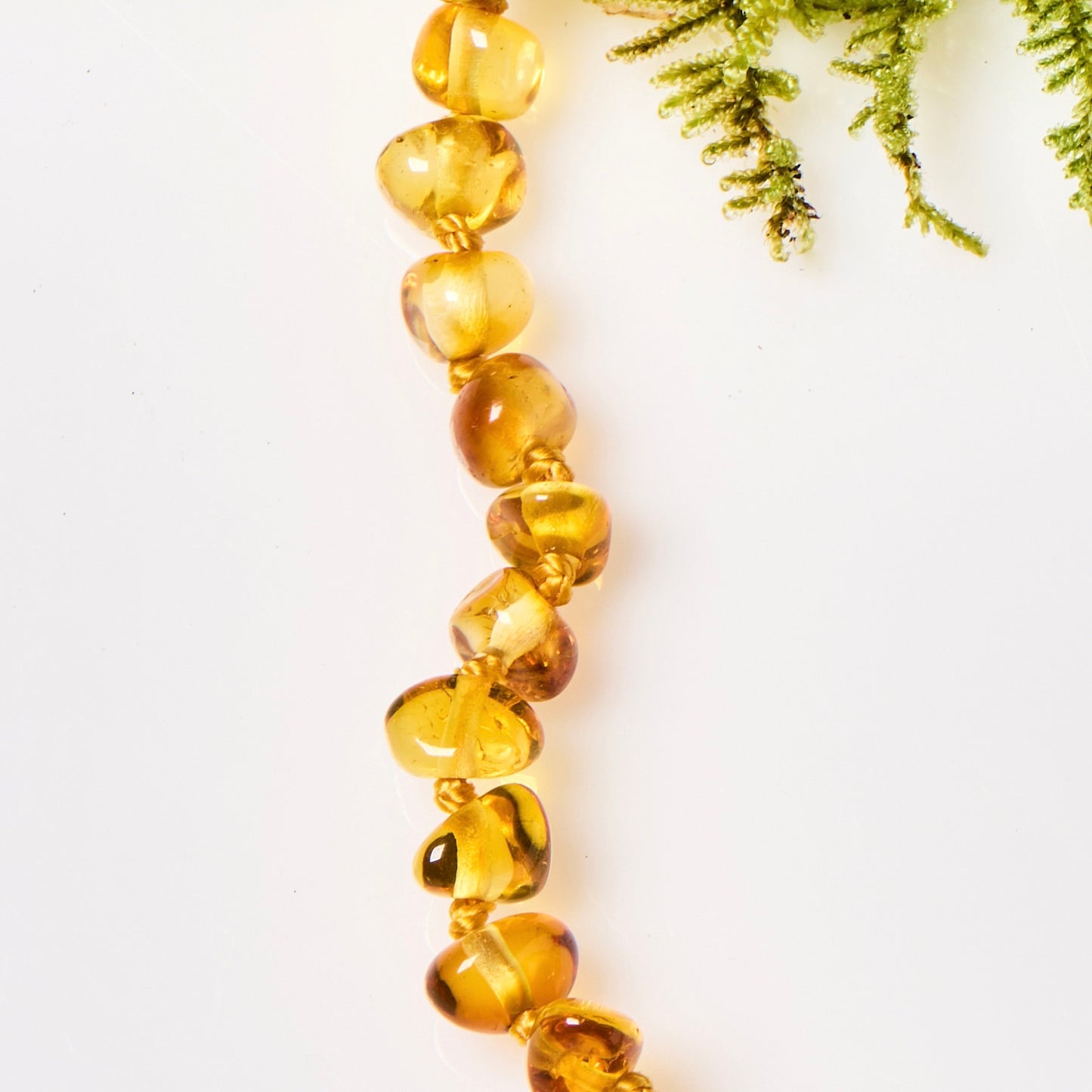 close up of honey amber beaded necklace