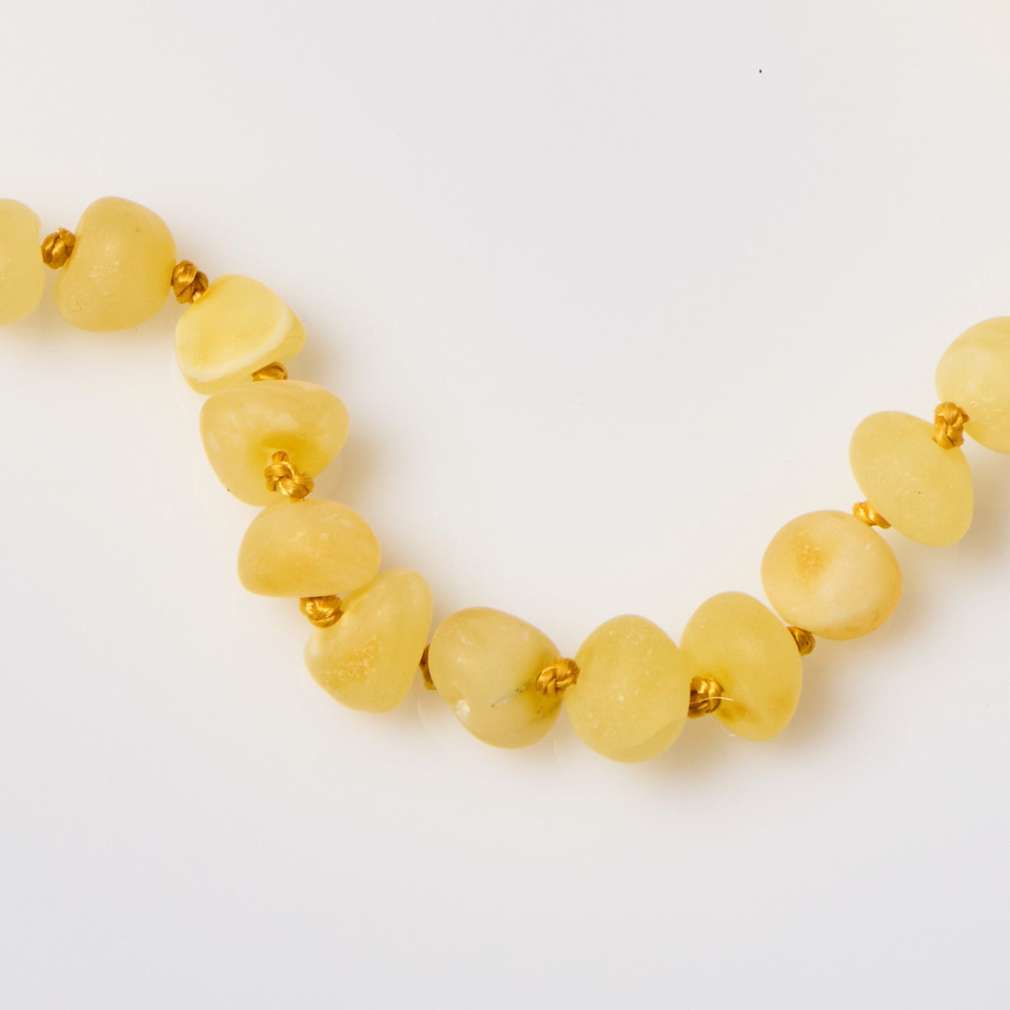 close up of raw baltic amber necklace