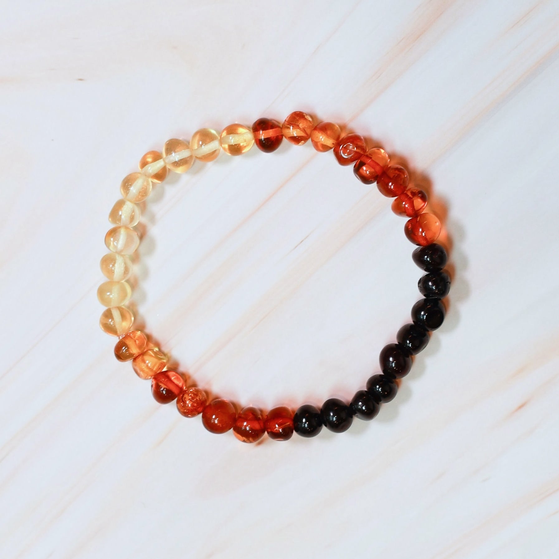 baltic amber bracelet in a rainbow of colors, used for adult pain relief
