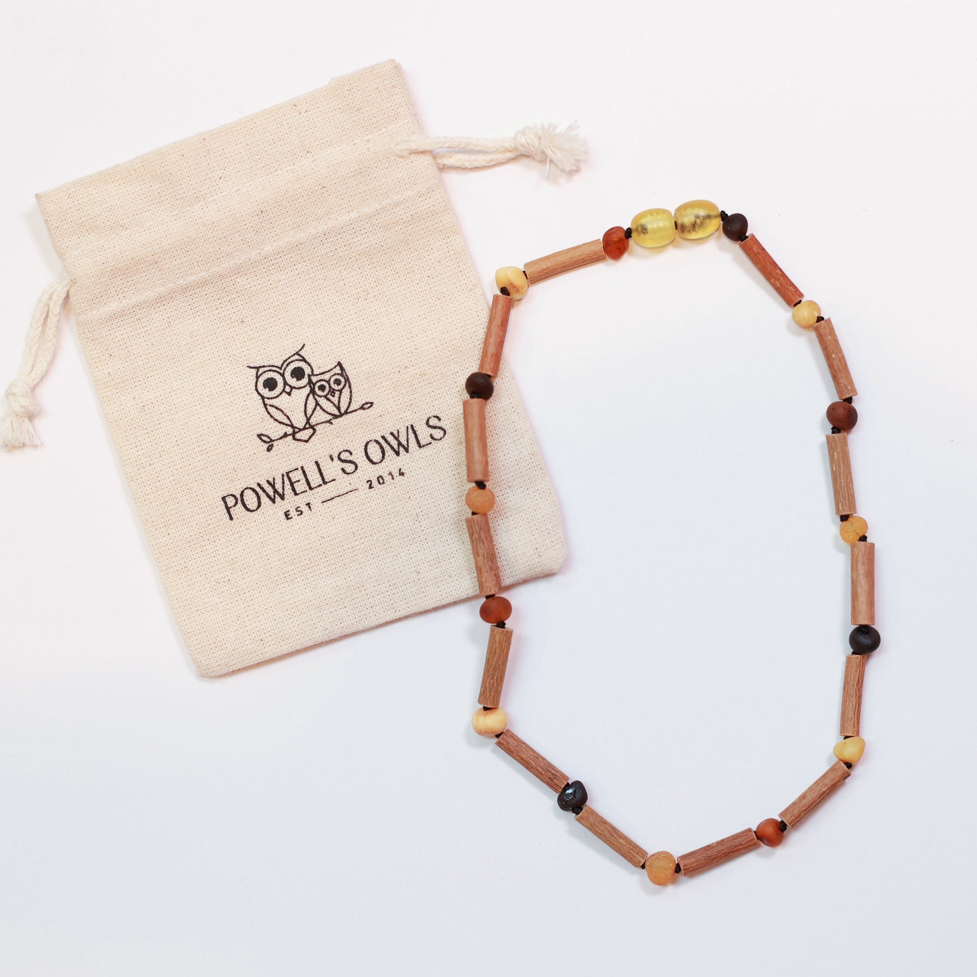 a baby teething necklace with raw Baltic amber beads and Canadian hazelwood